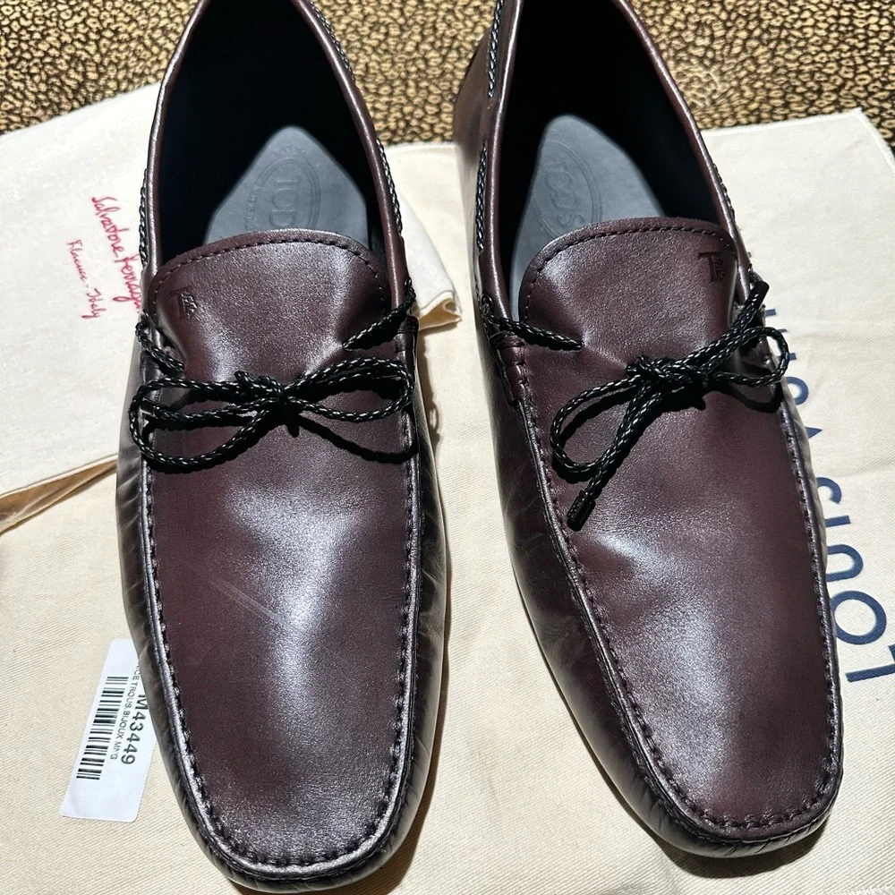 Tod's Men's Boat Shoes in Dark Brown with Black Laces